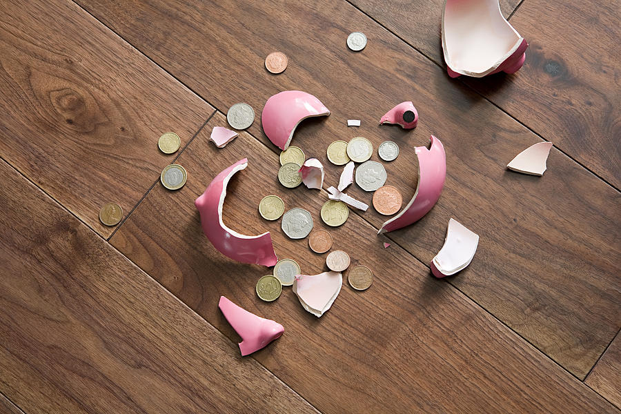 A smashed piggy bank Photograph by Image Source