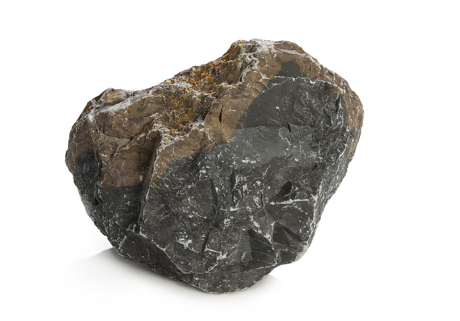 A solid dark rock on a white background Photograph by Enter89