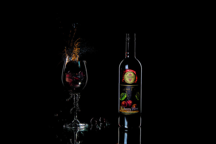 A splash of Cherry Wine Photograph by Dan Friend