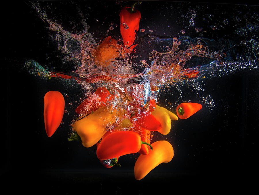 A Splash of Peppers Photograph by Bill Cubitt