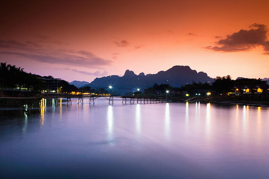 A stunning sunset on this Laos river. Photograph by Matthew Micah Wright