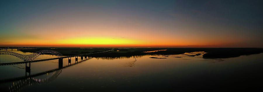 A Sunset Over The Mississippi River Photograph by Marcus Jones