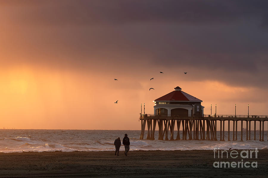 A Sunset walk on Huntington Beach California Photograph by Ronda Kimbrow