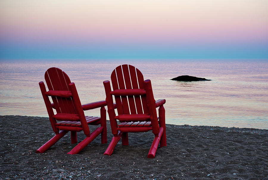 A Superior View - red chairs and Lake Superior sunset at Lutsen Resort Photograph by Peter Herman