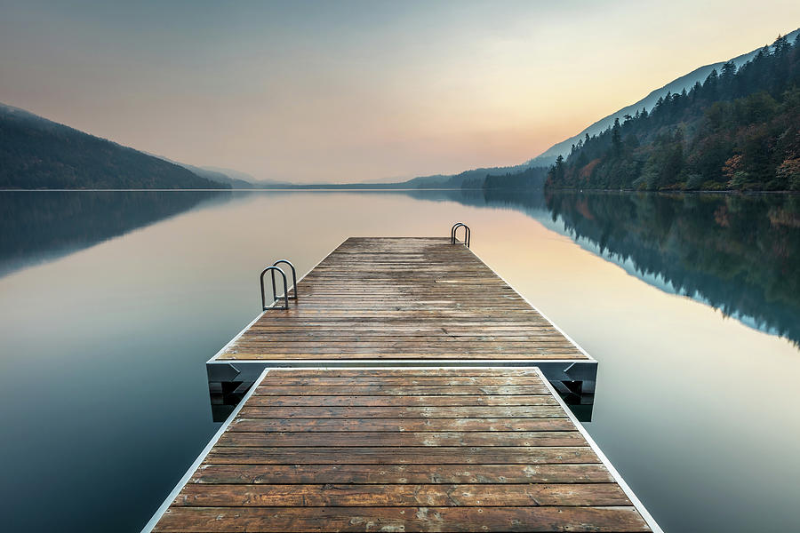 A swimming platform extending onto a calm Cultus Lake Photograph by Pierre Leclerc Photography