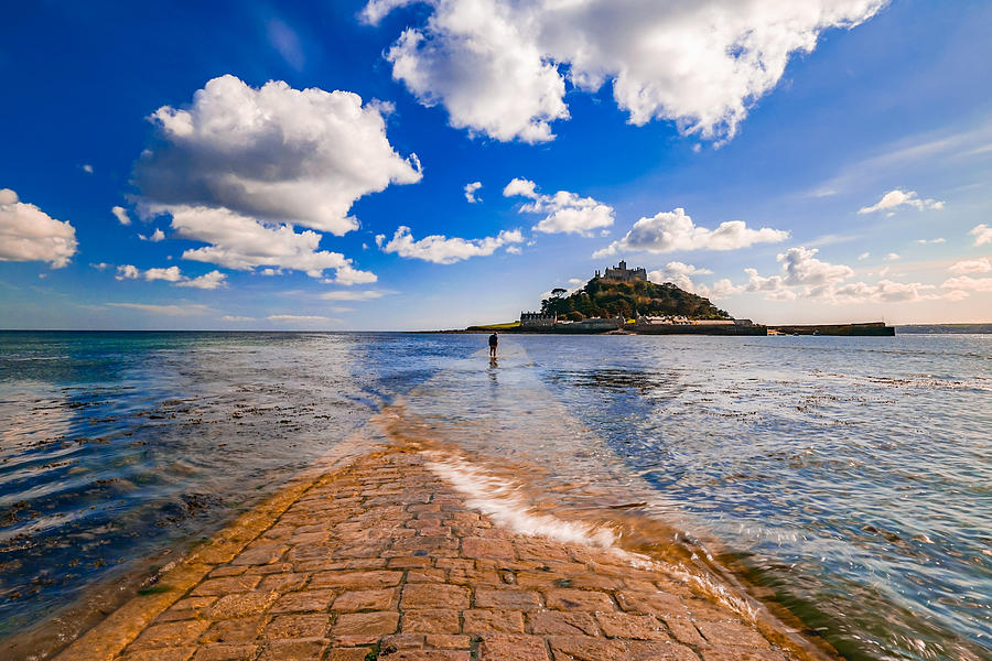 A Tourist Enjoying A Walk At St Michaels Mount In England At Low Tide. Photograph