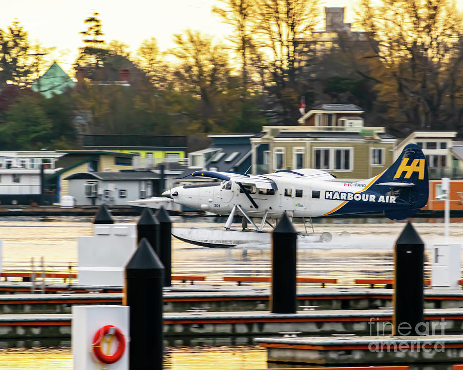 A Turbo Otter Landing In The Victoria Sunrise Past The Houseboat Photograph