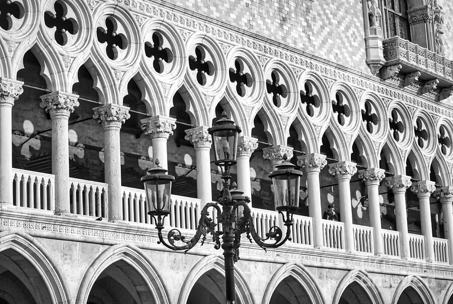 A Typical Venetian Street Lamp In Front Of The Ducal Palace Windows Photograph