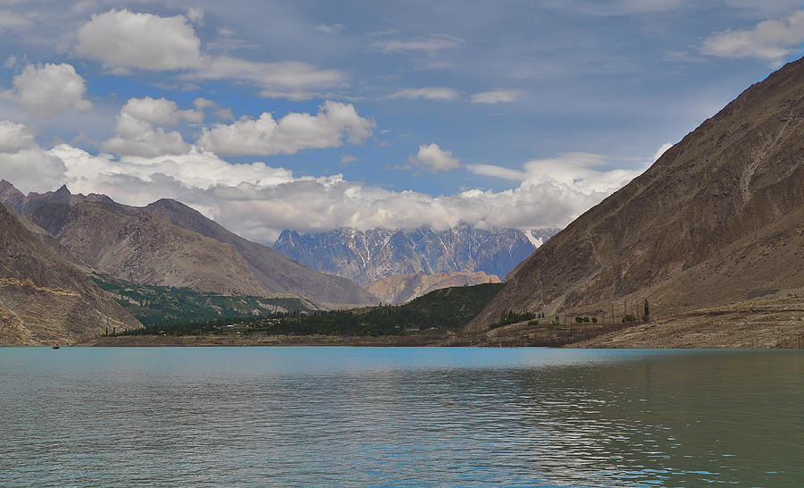 A view of the Passu Cones with their tips covered in clouds, from ...