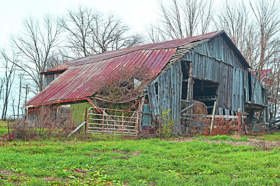 Farm Photograph - A Well Used Barn by Robert Tubesing