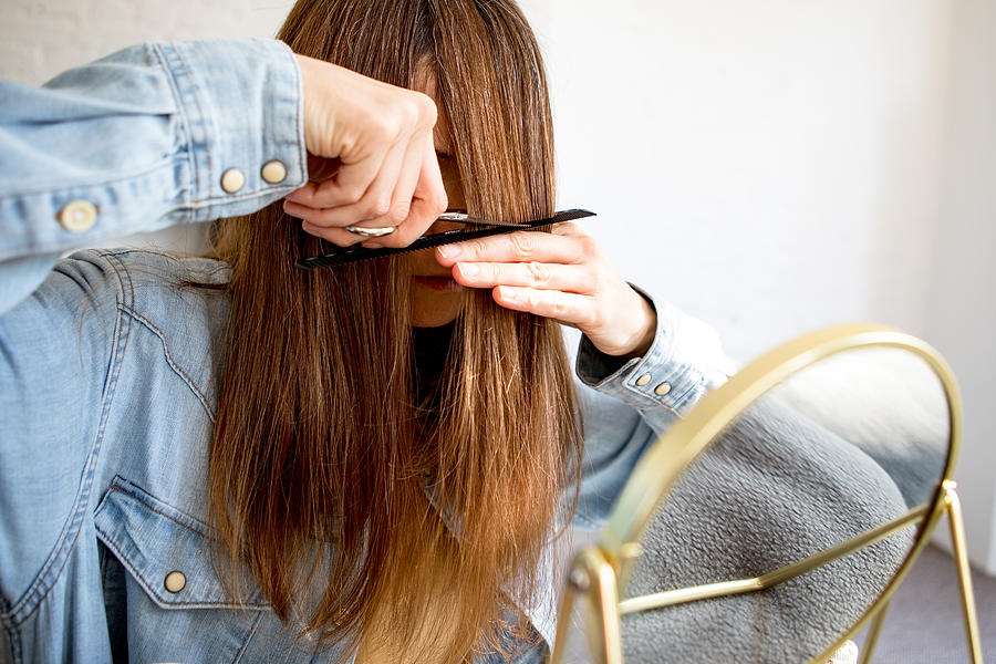 A woman cutting her own hair Photograph by Photographer, Basak Gurbuz Derman