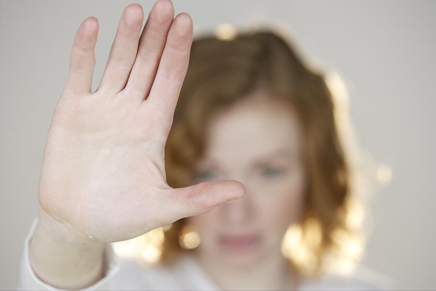 A woman gesturing with her hand up Photograph by Tetra Images