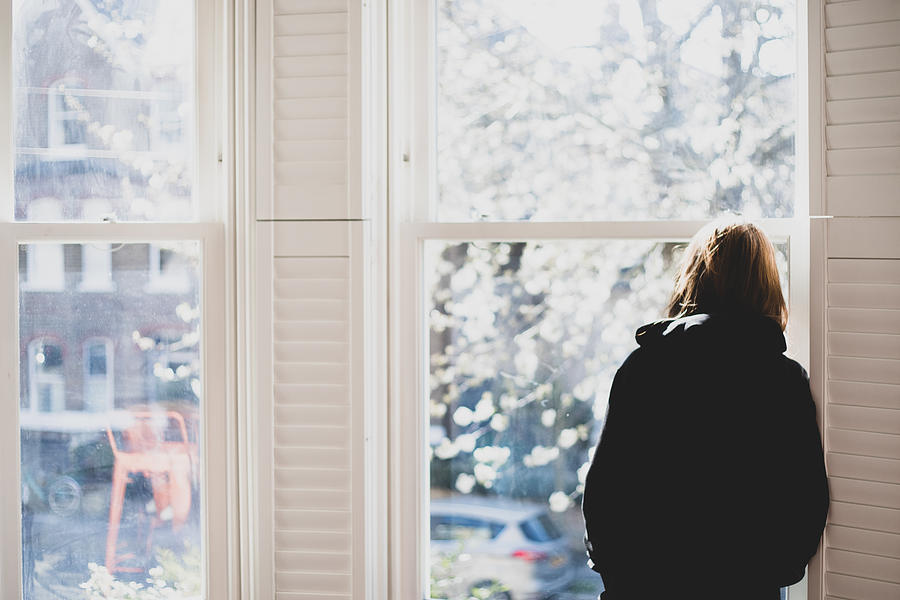 A woman looking through the window... Social distancing. Photograph by Photographer, Basak Gurbuz Derman