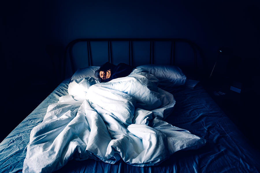 A woman sleeping in bed at night time Photograph by Photographer, Basak Gurbuz Derman