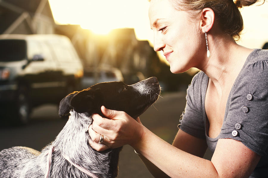 A woman touching the neck of her dog Photograph by CaseyHillPhoto