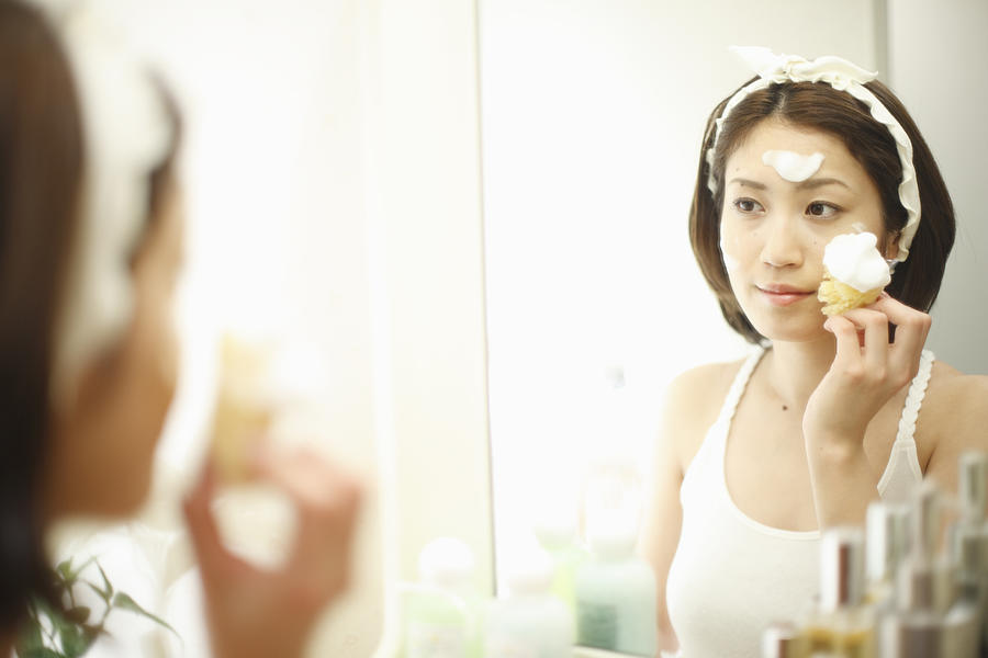 A woman washing her face Photograph by Imagenavi