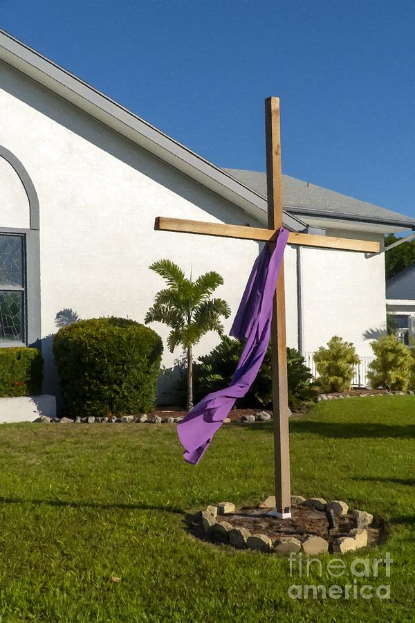 A wooden cross is draped with purple cloth during Easter week on Anna Maria Island, Florida, USA Photograph by William Kuta