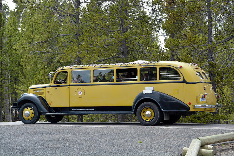 A Yellowstone Touring Bus Cruises by Grotto Geyser  Photograph by Bruce Gourley