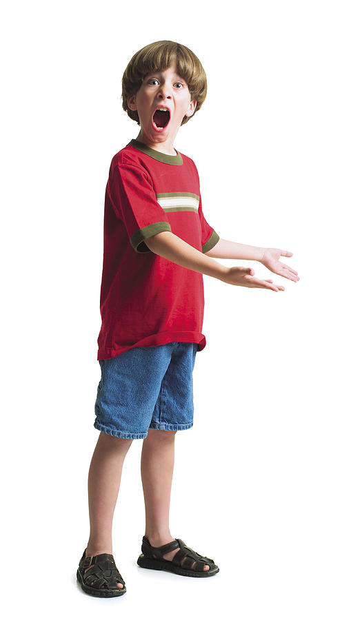 A Young Caucasian Boy Wearing Jean Shorts And A Red Shirt Stands With His Hands Held Out To The Side With A Look Of Suprise On His Face Photograph by Photodisc