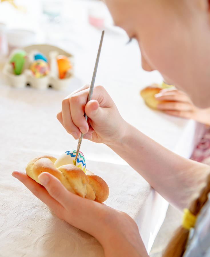 A young girl decorating Easter cakes Photograph by Tatiana Kolesnikova