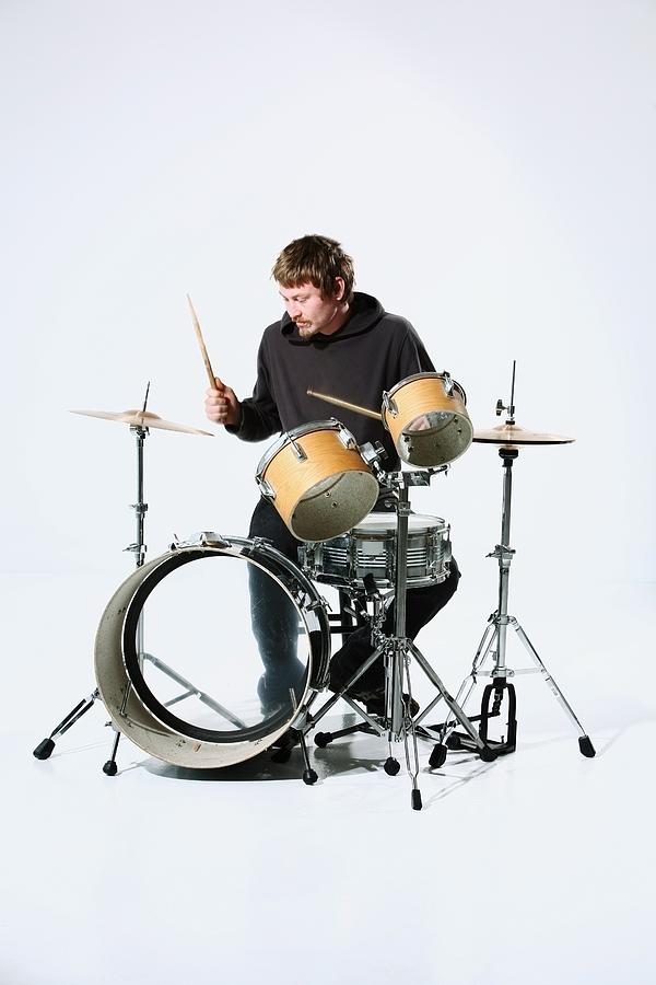 A Young Man Playing The Drums Photograph by Design Pics / Colleen Cahill