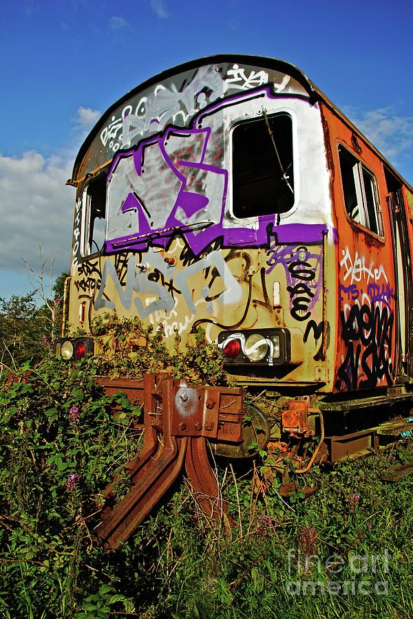 Abandoned and graffiti covered railway carriage. Photograph by David Birchall