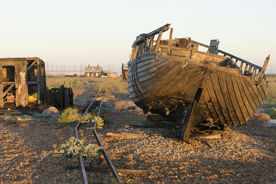 Abandoned boat and shed in Dungeness UK Photograph by Tim Bird