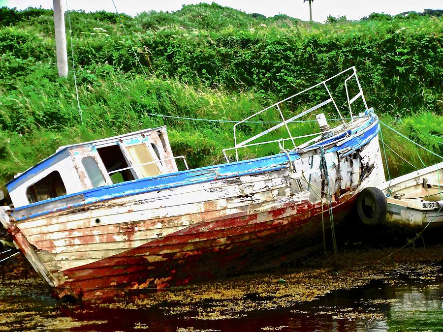 Abandoned boat Photograph by Stephanie Moore