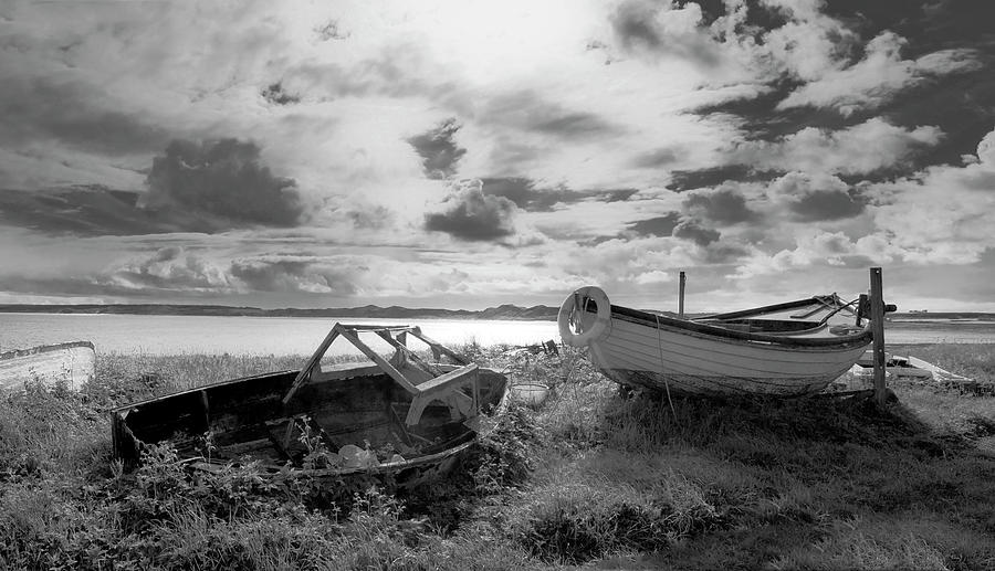 Abandoned boats Photograph by Remigiusz MARCZAK
