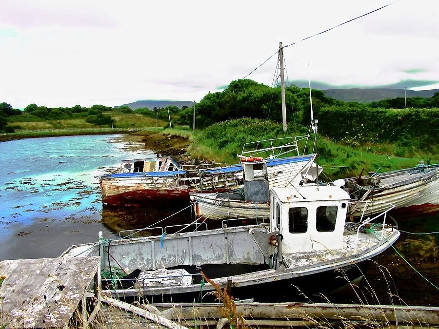 Abandoned boats Photograph by Stephanie Moore