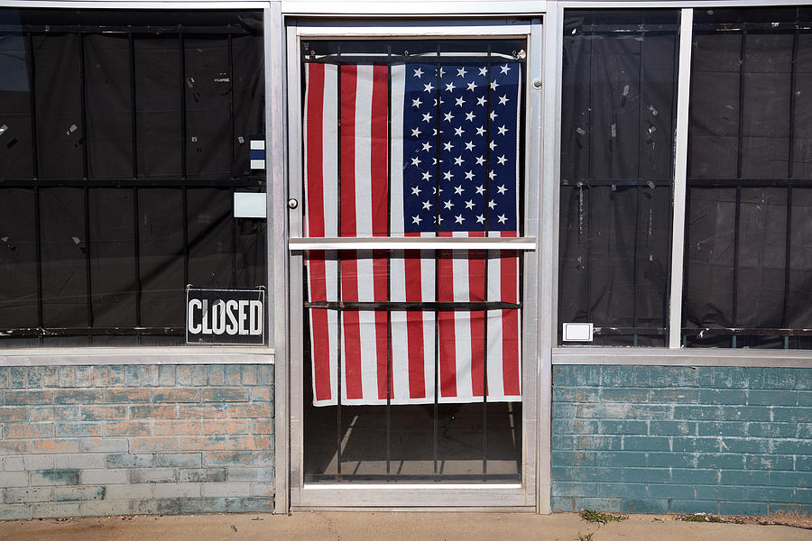 Abandoned building and American flag behind the door at Paris, Texas, USA Photograph by Feifei Cui-Paoluzzo