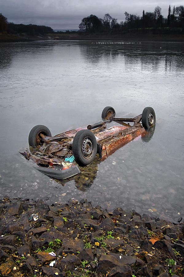Abandoned car in water Photograph by Photography by David A Johnson.