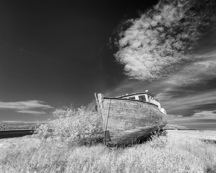 Abandoned fishing vessel under clouds in infrared Photograph by Murray Rudd