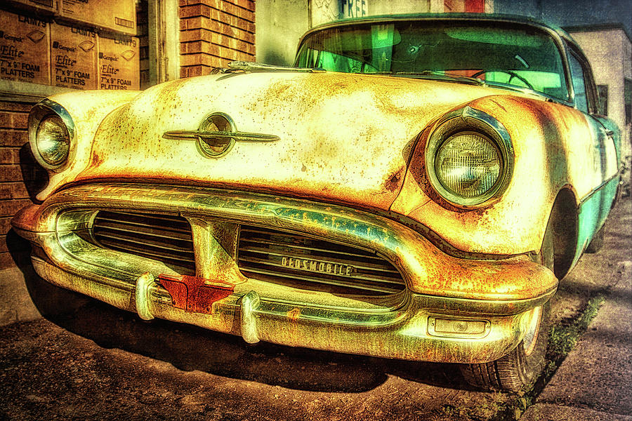 Abandoned old Oldsmobile Photograph by Tatiana Travelways