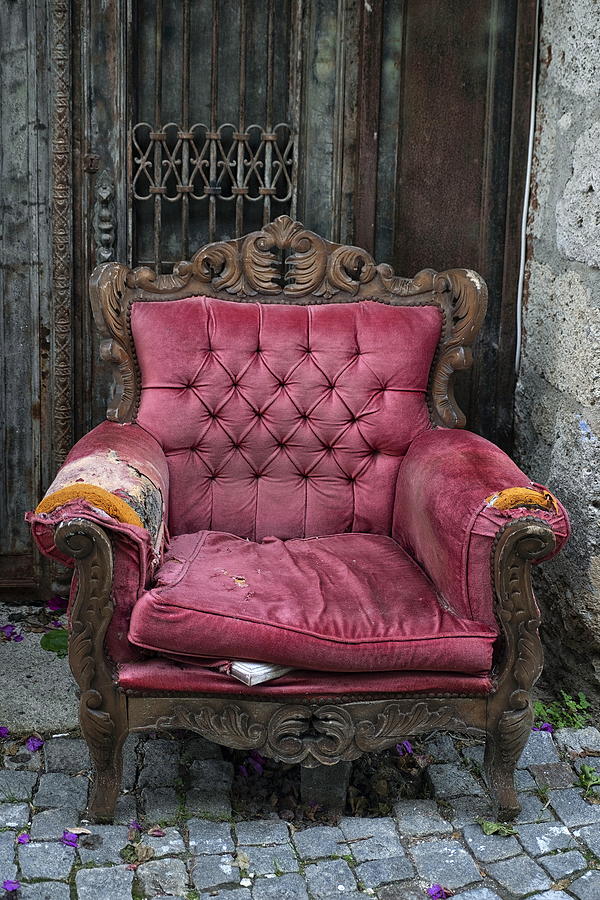 abandoned old purple velvet armchair in the street,Alacati. Photograph by Emreturanphoto