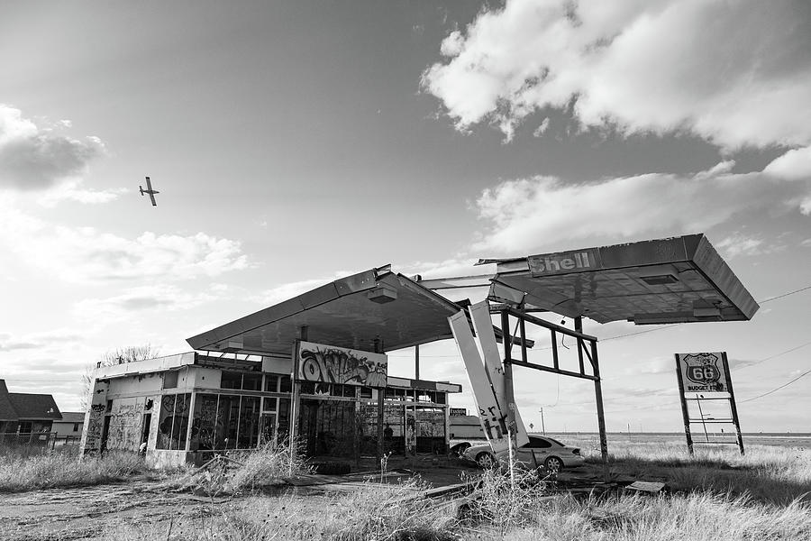 Abandoned Route 66 Budget Fuel gas station in Texas in black and white Photograph by Eldon McGraw