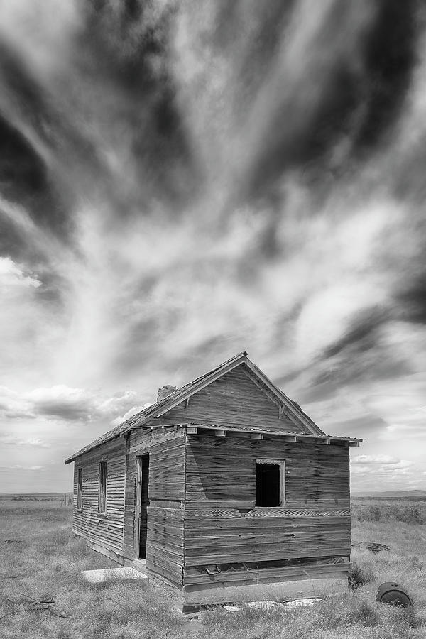 Abandoned shack and cloud formations in Utah desert Photograph by Murray Rudd