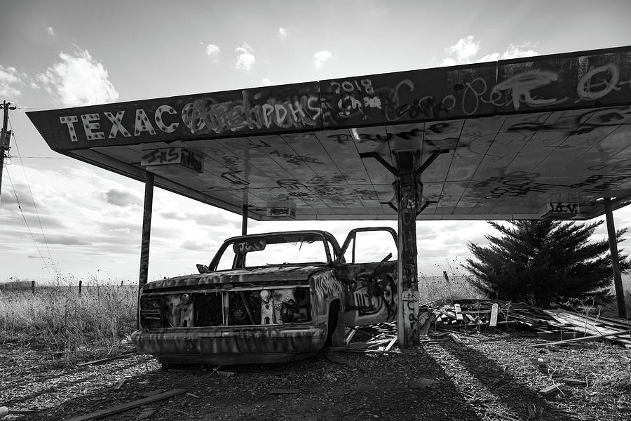Abandoned Texaco station on Historic Route 66 in Texas in black and white Photograph by Eldon McGraw