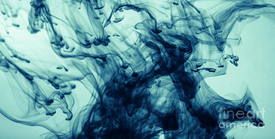 Abstract color paint splash on blue background. Photograph by Jelena Jovanovic