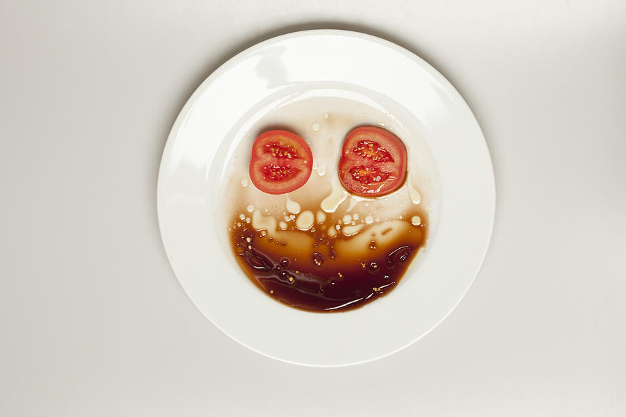 Abstract face made from tomato, plate and balsamic vinegar Photograph by Larry Washburn