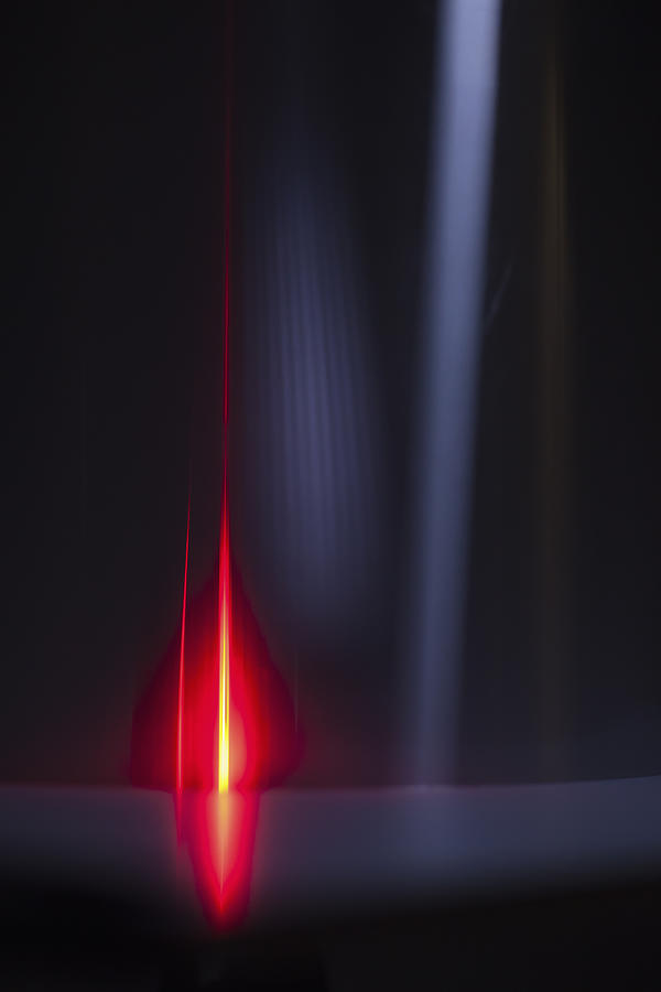 Abstract image of red and gray light trails over black background Photograph by Ralf Hiemisch