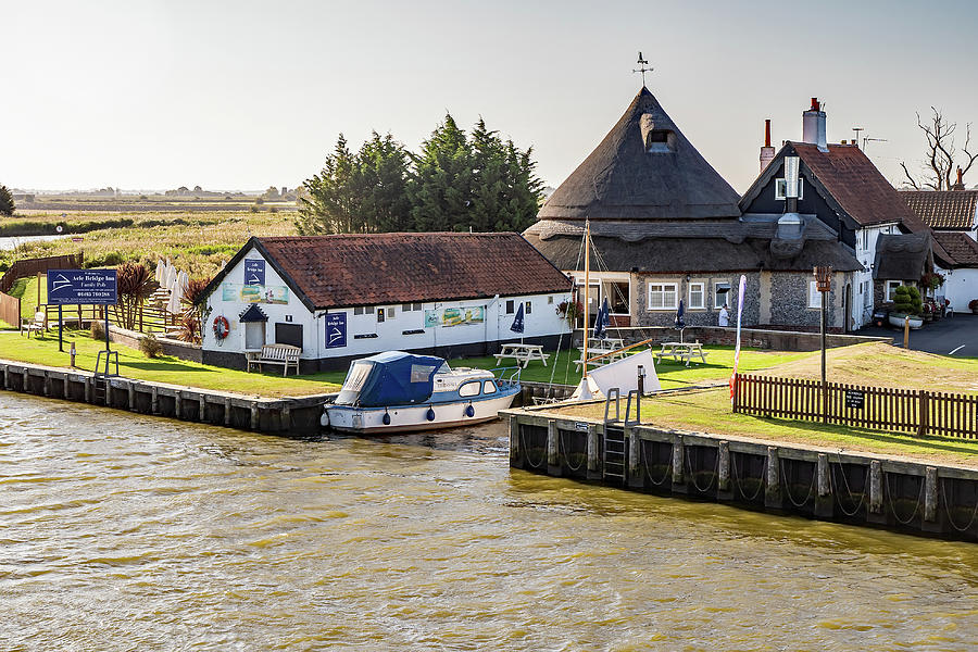 Acle Bridge pub on the River Bure, Norfolk Photograph by Chris Yaxley