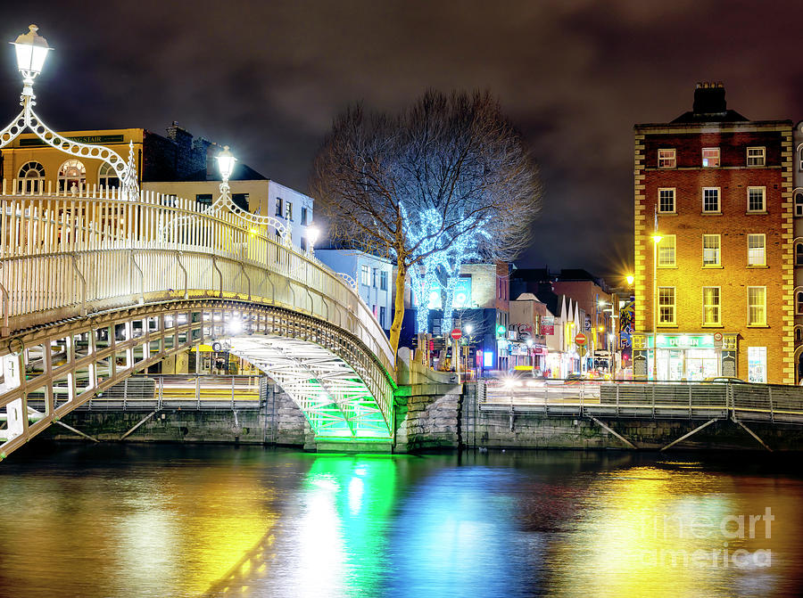 Across the HaPenny Bridge at Night in Dublin Ireland Photograph by John Rizzuto