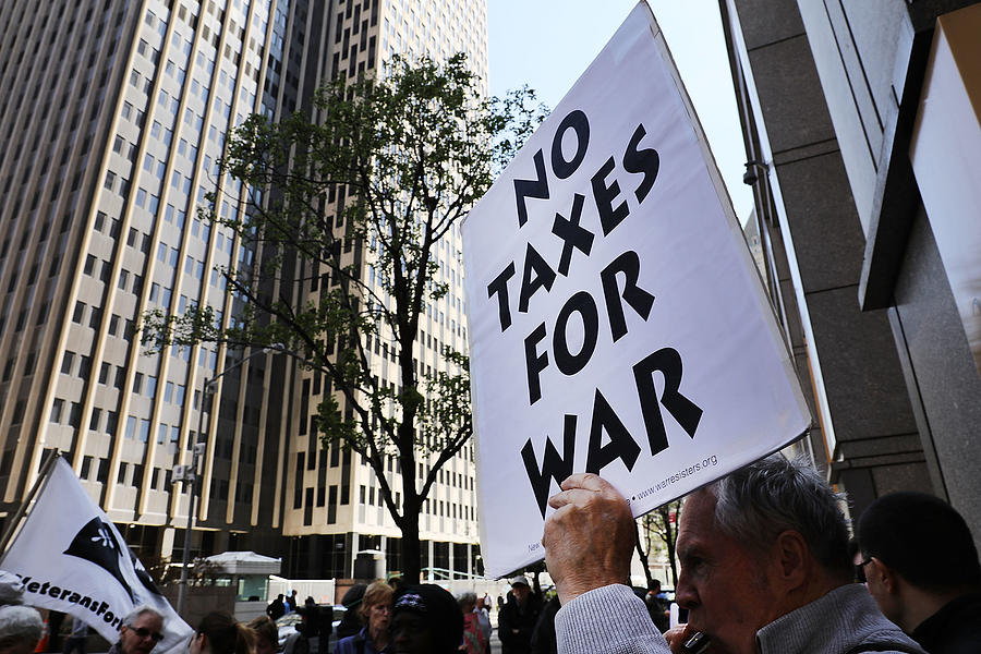 Activists Protest Tax Dollars Being Spent On U.S. Wars At NYC IRS Building Photograph by Spencer Platt Activists Protest Tax Dollars Being Spent On U.S. Wars At NYC IRS Building Photograph by Spencer Platt