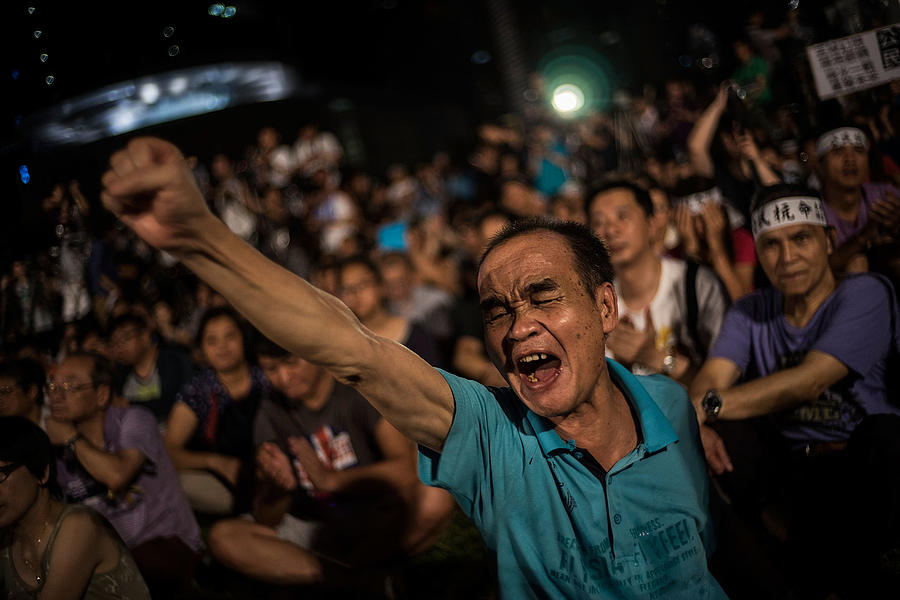 Activists Take To The Streets As China Votes On Hong Kong Election Process Photograph by Lam Yik Fei