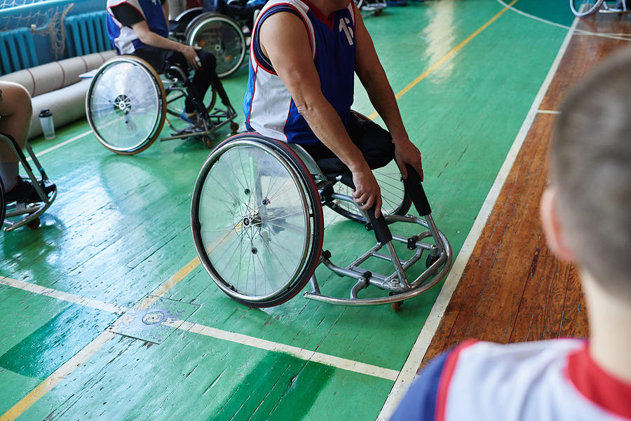 Adaptive athlete in wheelchair Photograph by CliqueImages
