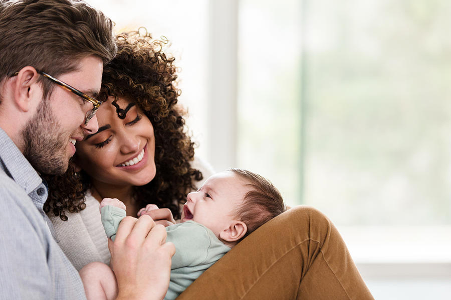 Adorable young family with newborn Photograph by SDI Productions