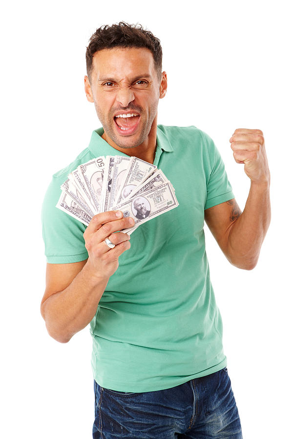 Adult male holding a stack of money. Photograph by Stocknroll