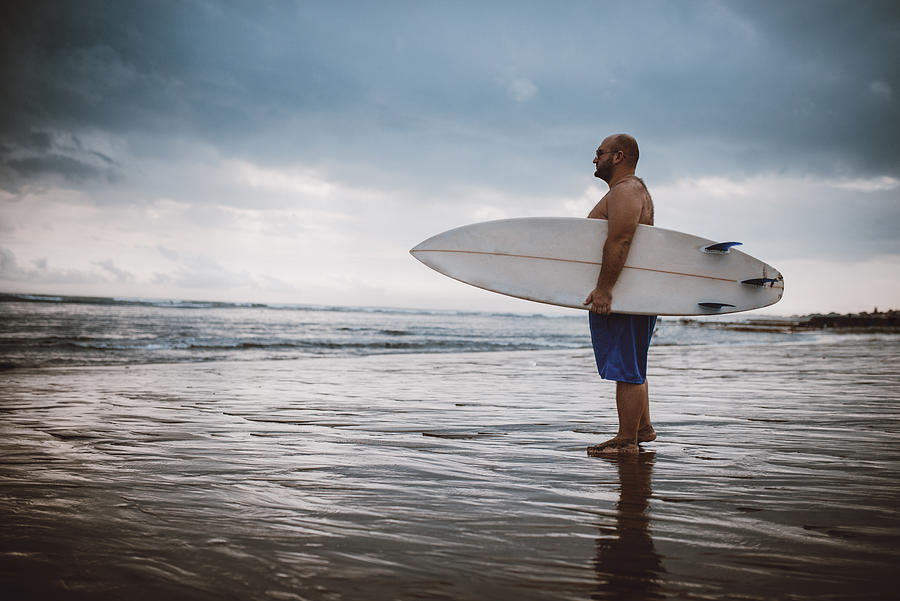 Adult Male Planning To Surf In Sea Indonesia Photograph by AleksandarGeorgiev