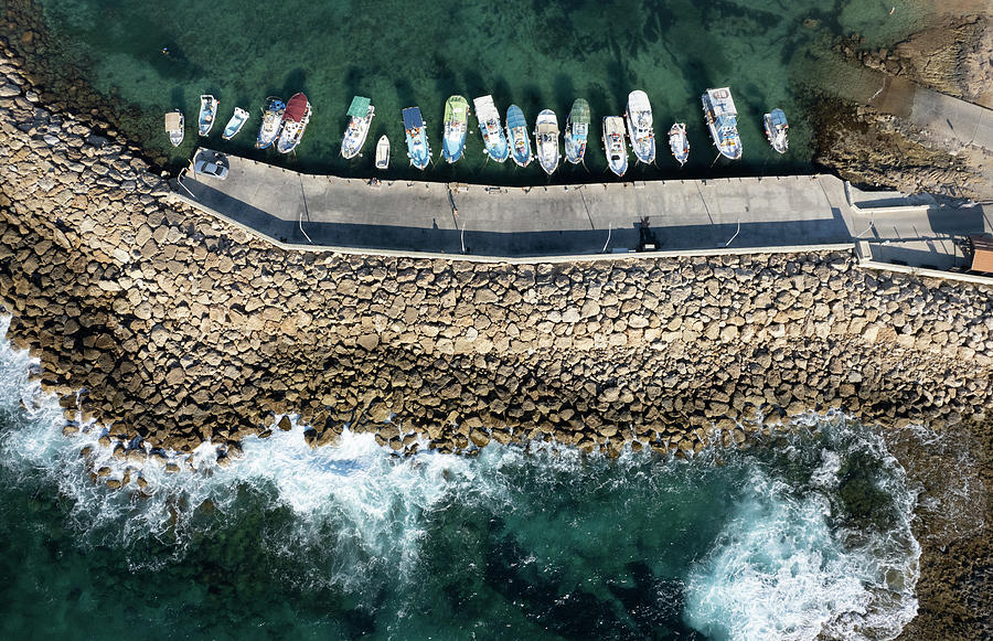 Aerial drone view of fishing boats moored at the harbor Photograph by Michalakis Ppalis